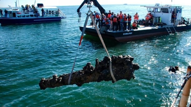 File photo - A one-ton cannon which was recovered from the Queen Anne's Revenge shipwreck site, is pulled from the water near Beaufort, North Carolina, Oct. 26, 2011. 