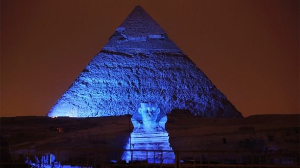 FILE - In this Saturday, Oct. 24, 2015, file photo, the Sphinx and the historical site of the Giza Pyramids are illuminated with blue light, as part of the celebration of the 70th anniversary of the United Nations in Giza, just outside Cairo, Egypt. Archaeologists in Egypt say they have discovered a 4,400-year-old tomb near the pyramids outside Cairo. Egyptâs Antiquities Ministry announced the discovery Saturday and said the tomb likely belonged to a high-ranking official known as Hetpet during the 5th Dynasty of ancient Egypt. (AP Photo/Amr Nabil, File)