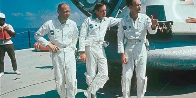 **ADVANCE FOR THURSDAY, JULY 16** FILE - In this 1969 file photo, Apollo 11 astronauts stand next to their spacecraft in 1969, from left to right: Col. Edwin E. Aldrin, lunar module pilot; Neil Armstrong, flight commander; and Lt. Michael Collins, command module pilot. (AP Photo, file)