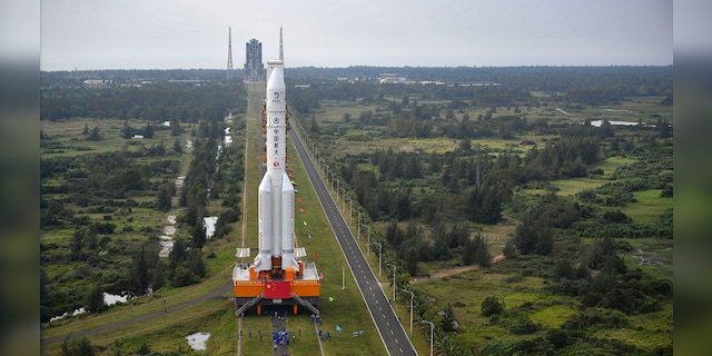 In this Nov. 17, 2020, photo released by China's Xinhua News Agency, a Long March-5 rocket is moved at the Wenchang Space Launch Site in Wenchang in southern China's Hainan Province. 