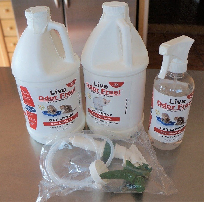 stinky dog photo - 2 gallon bottles of Live Odor Free, a small spay bottle, and a larger spray attachments for the big bottles
